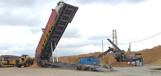 Bàn nâng xe container đổ dăm gỗ di động